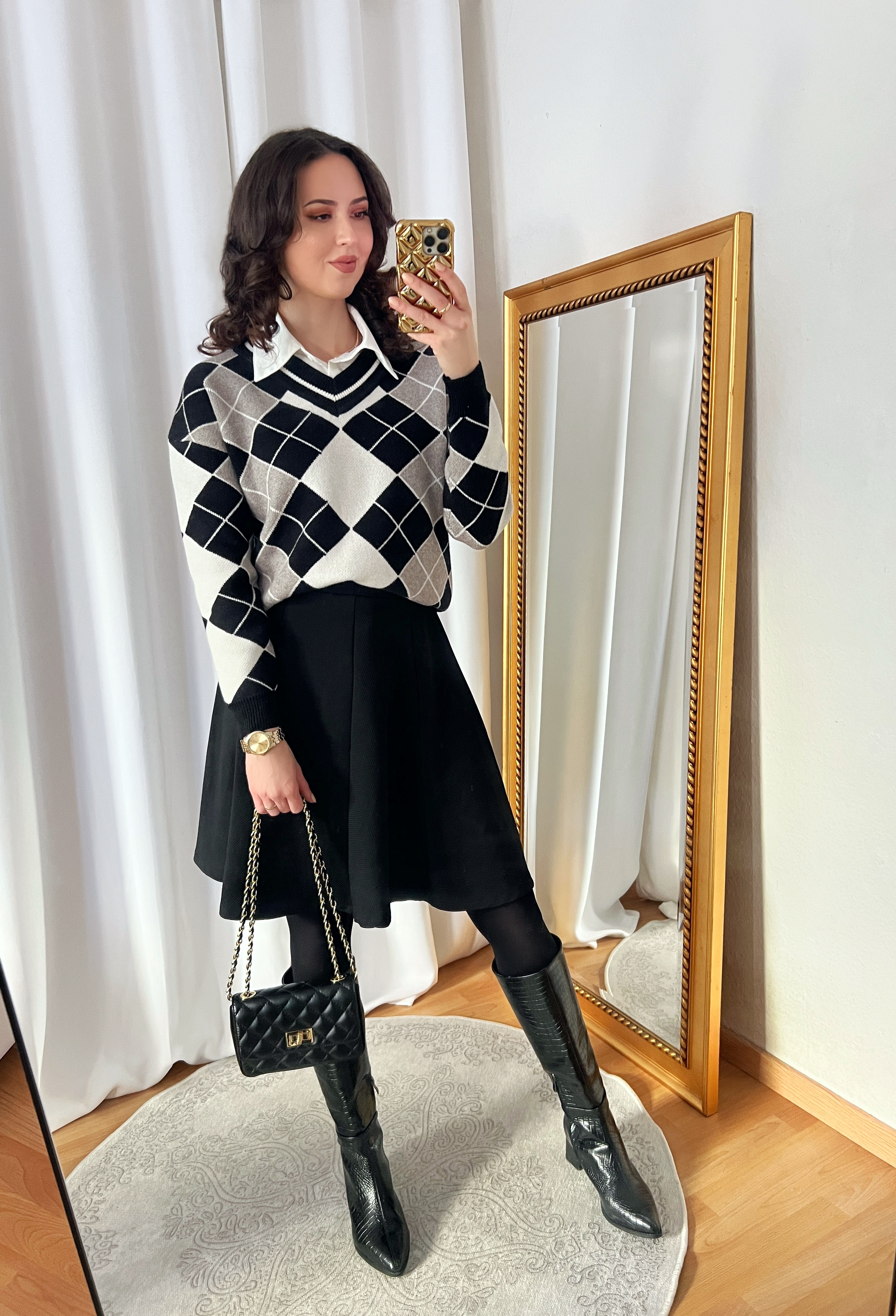 Black and White Argyle Sweater and Black Skirt Outfit